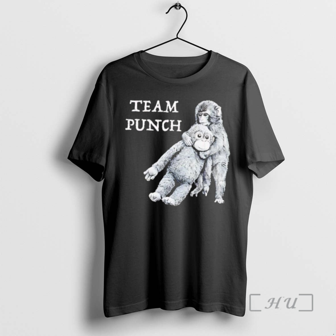Officials Team Punch Monkey Holding Orange Stuffed Animal Friend